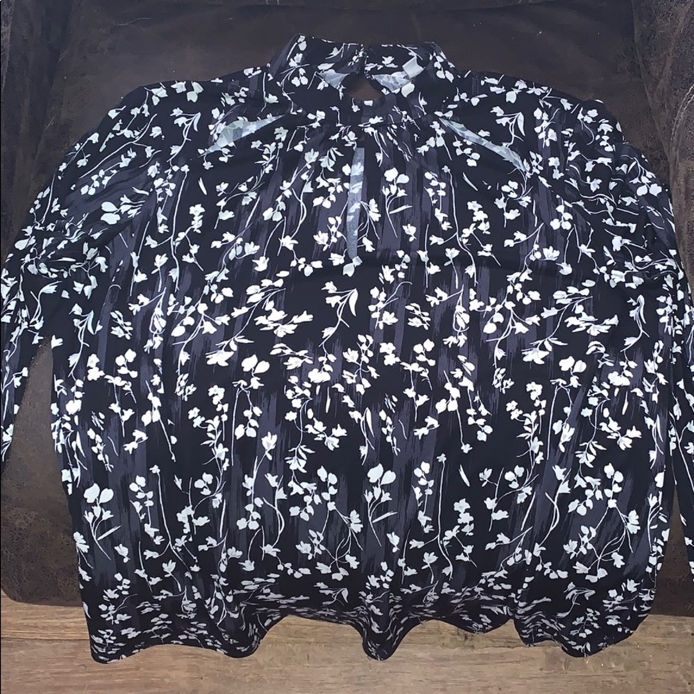 Cute long sleeve top has peekaboo front cuts